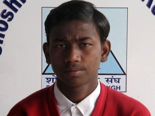 Manoj in his uniform at school